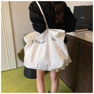 Detail of white large-capacity tote bag made from eco-friendly recyclable nylon fabric