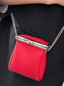 Red pebbled leather mini lipstick bag with metal kiss lock and silver chain strap