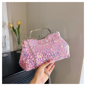 Detailed shot of pink sequin evening bag with silver metal frame and pearl clasp