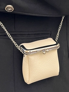Chic off-white litchi leather mini lipstick bag with silver chain crossbody strap