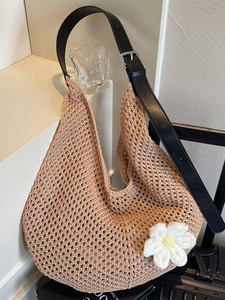 Minimalist beige hollow knit shoulder bag with daisy detail and black leather strap