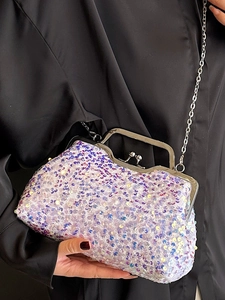 Sparkly white sequin evening shell bag with silver metal handle and chain strap