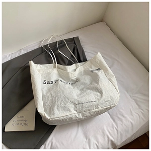 Detailed close-up of white wrinkled recyclable tote bag with San Francisco print