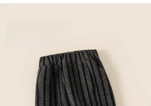 Detail of grey striped children pants with elastic waistband and thick warm fleece fabric
