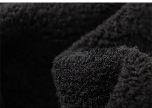 Detail view of thick black fleece lining texture for kids winter thermal trousers