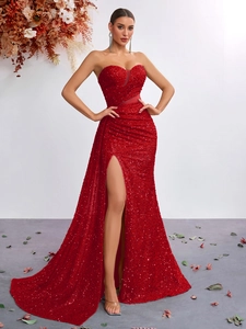 Macro shot of red sequins fabric and sweetheart neckline detail on the evening gown