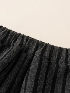 Thick velvet winter joggers for kids featuring elastic waistband and vertical texture