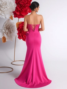 Fuchsia strapless fishtail evening gown with lace-up back and ruffled side detail