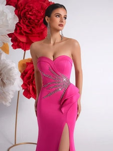 Elegant rose red strapless evening gown with rhinestone starburst and ruffle slit