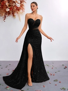 Detailed view of black sequin mermaid dress with heart-shaped neckline and mesh waist