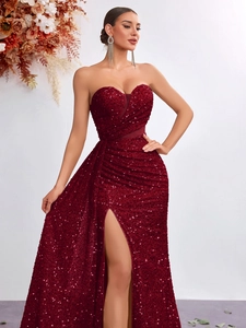 Detailed view of burgundy sequined sweetheart bodice and high-slit fishtail skirt
