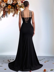 Elegant black fishtail evening gown with rhinestone halter neck and backless lace-up detail