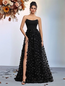 Elegant black strapless evening dress with 3D floral petals and a side slit design