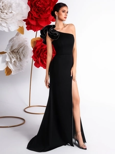 Elegant black one-shoulder evening dress with ruffled sleeves and high slit detail