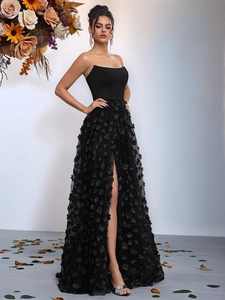 Elegant black strapless evening dress with 3D floral petals and a side slit mesh skirt