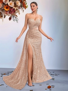 Detail view of champagne gold sequins and side slit on this elegant evening dress