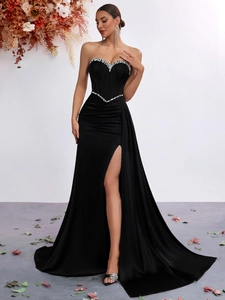 Elegant strapless black evening dress with crystal trim and high slit detail