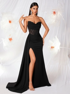 Elegant black strapless evening dress with corset bodice, lace trim and high side slit