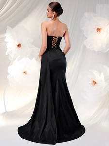 Elegant strapless fishtail evening gown with lace-up back and long floor-length train