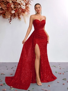 Detail of red sequin evening gown showing the heart-shaped neckline and draped waist