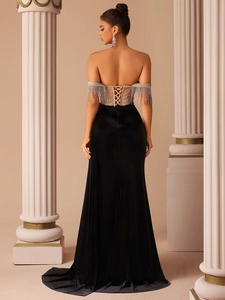 Luxurious black velvet evening gown with sequin fringe and lace-up corset back detail
