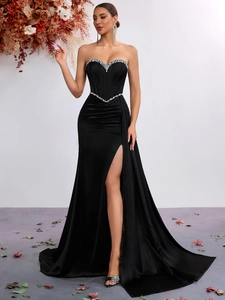 Elegant strapless black satin evening gown with silver rhinestone waist and high leg slit