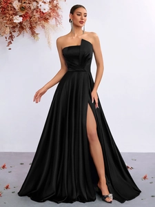 Detailed view of the elegant black strapless satin evening gown with a high side slit