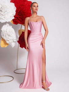 Pink rhinestone corset evening gown with high slit and elegant satin fishtail silhouette