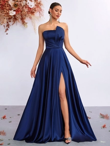 Detail of elegant navy blue satin evening gown featuring pleated bodice and high side slit