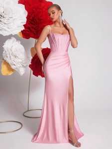 Pink sequin corset evening gown with high slit and fisheye silhouette for elegant events