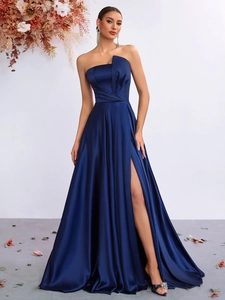 Detail of elegant navy blue satin dress with irregular neckline and waist pleats