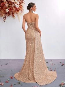 Sparkling champagne gold sequined tube top fishtail evening gown with lace-up back detail