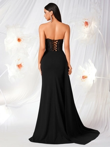 Elegant strapless black evening gown with lace-up back and floral lace detailing