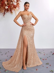 Elegant champagne gold sequin strapless evening gown with high slit and mermaid silhouette