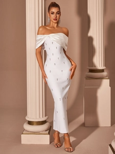 Detail of the elegant white off-shoulder gown with sparkling rhinestones and satin neckline