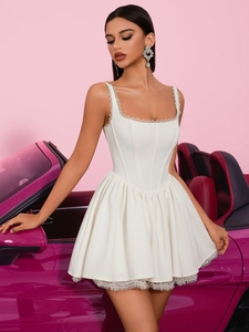White lace corset mini dress with square neck and flared skirt in a fashion photo