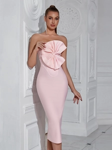 Elegant light pink strapless mermaid dress with oversized decorative bow and textured detail