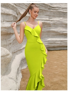 Detail of elegant ruffle design and fishtail hemline on a slim fit party dress