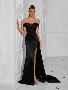 Detail of elegant black off-shoulder evening dress with sweetheart neckline and high slit