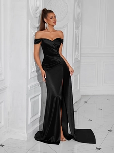 Detailed view of elegant off-shoulder black evening gown with side slit and waist pleats