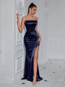 Detailed view of dark blue satin evening dress showing elegant side high slit and fabric