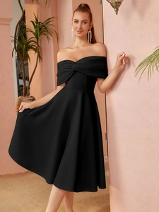 Detail of elegant black off-the-shoulder dress with knot design and A-line silhouette