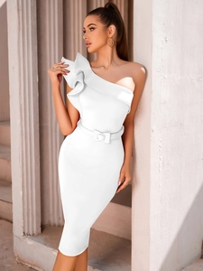 Detail view of elegant one-shoulder dress featuring sculptural ruffle and waist belt