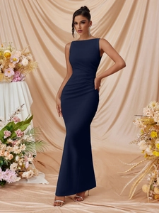 Detail of elegant dark blue sleeveless gown featuring side ruching and floor-length hemline