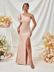 Detail view of one-shoulder dress with rhinestone waist decor and high side slit