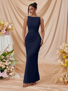 Detail of elegant dark blue sleeveless evening gown with side ruching and slit effect