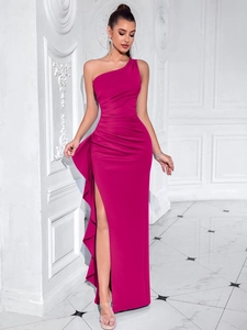 Detail of magenta one-shoulder evening dress featuring pleated waist and ruffled side slit