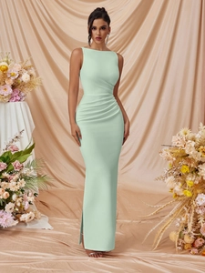 Detail of mint green sleeveless dress with waist ruching and elegant side slit