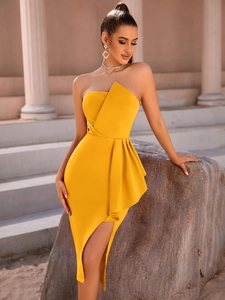Detail of elegant yellow off-shoulder dress featuring ruffled tiers and high side slit