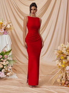 Detail of red sleeveless gown showing elegant side ruching and sleek slim-fit texture